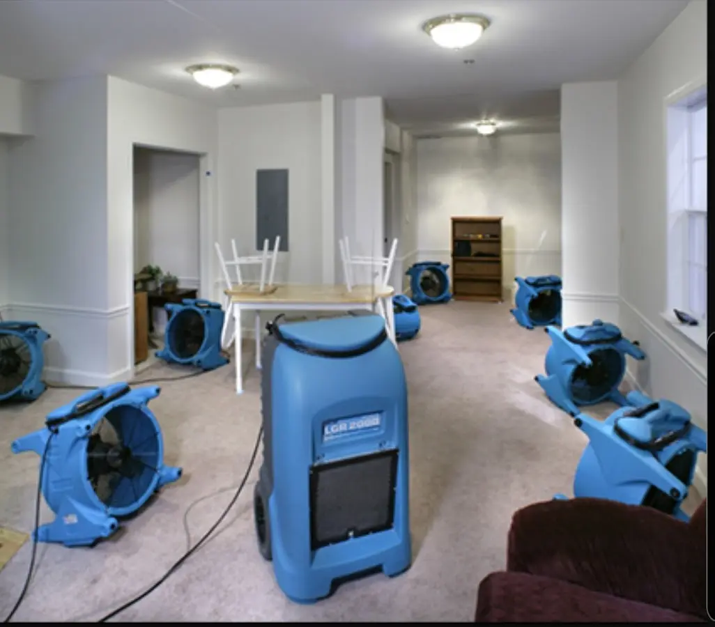 Air movers and dehumidifier setup for Water Damage Restoration in Raymond